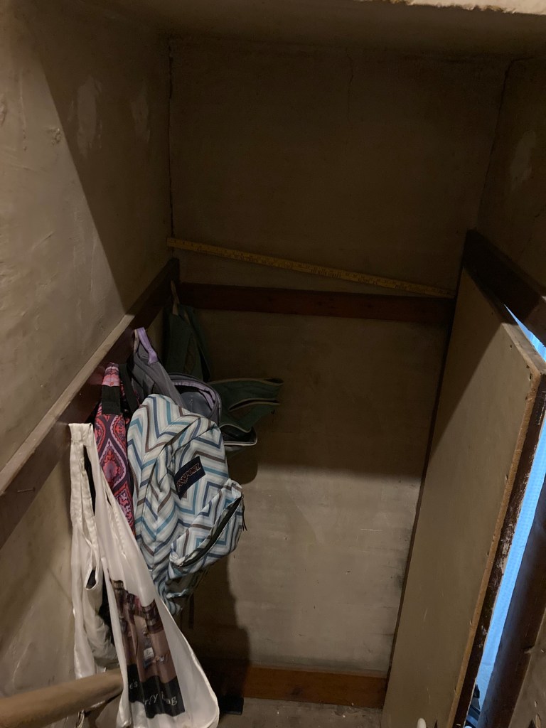 yardstick in the attic stairwell